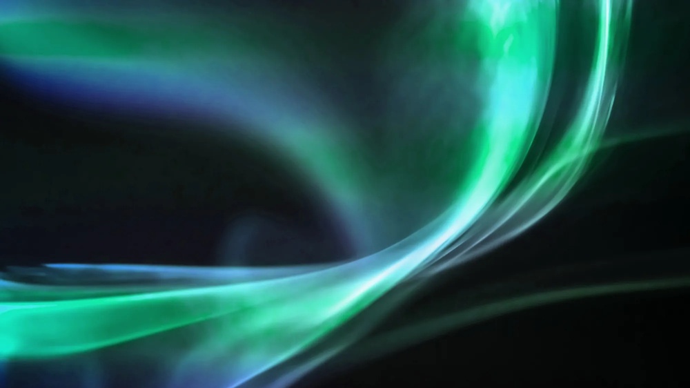 Abstract, flowing light shapes in green, blue, and violet tones, moving dynamically across a dark background with soft transitions and transparency