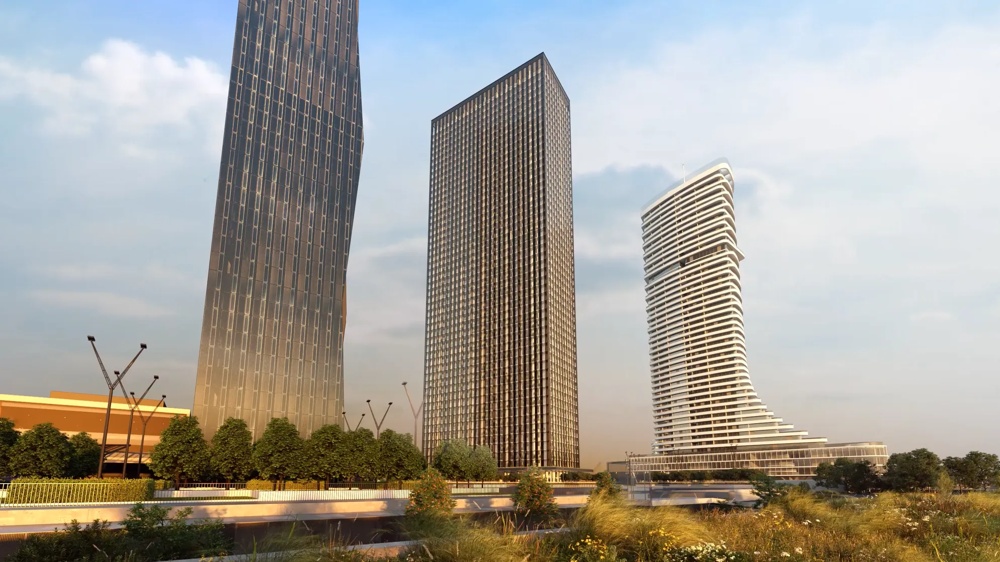 Visualisierung des DC Tower 2 in Wien – drei markante Hochhäuser im Donau City Areal, darunter der geschwungene Wohnturm rechts – ein hausInvest-Objekt.