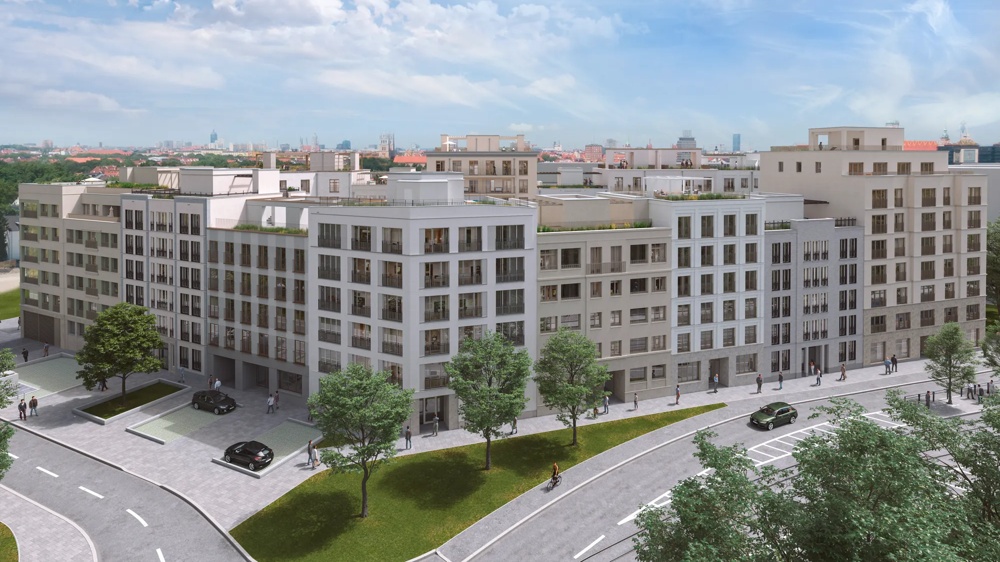 Moderne Wohngebäude mit vielen Fenstern, Bäumen und Autos auf der Straße, unter einem blauen Himmel mit Wolken.