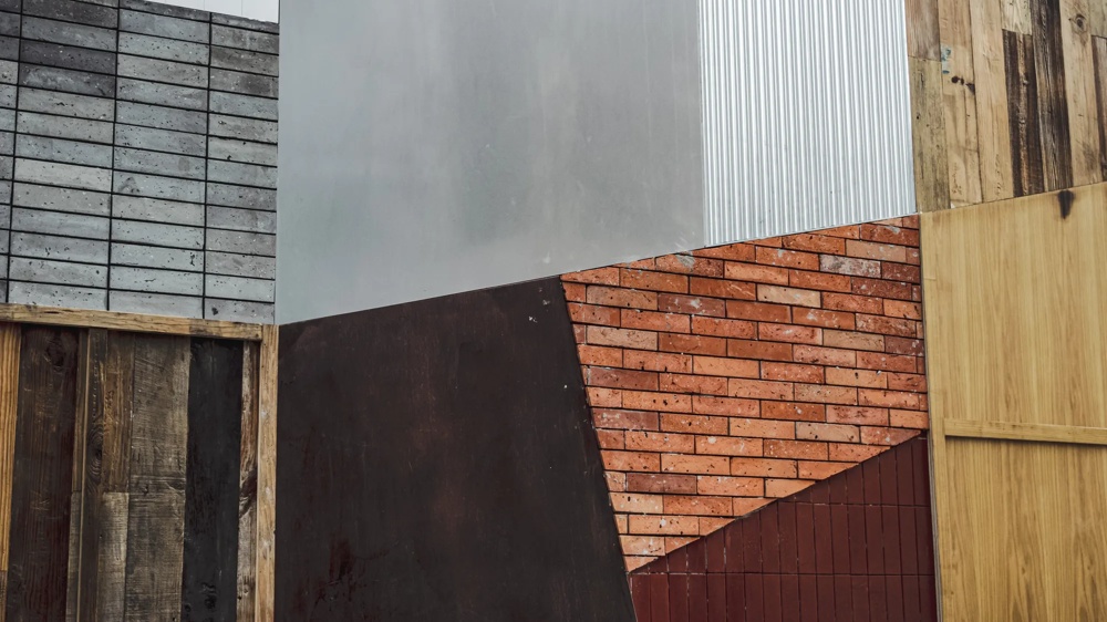 Different wall textures: Metal, brick, wood and concrete arranged in geometric shapes.