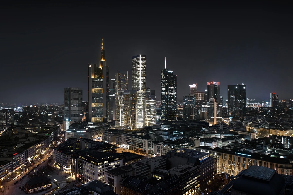 The skyline of a city at night with illuminated high-rise buildings and a dark sky.