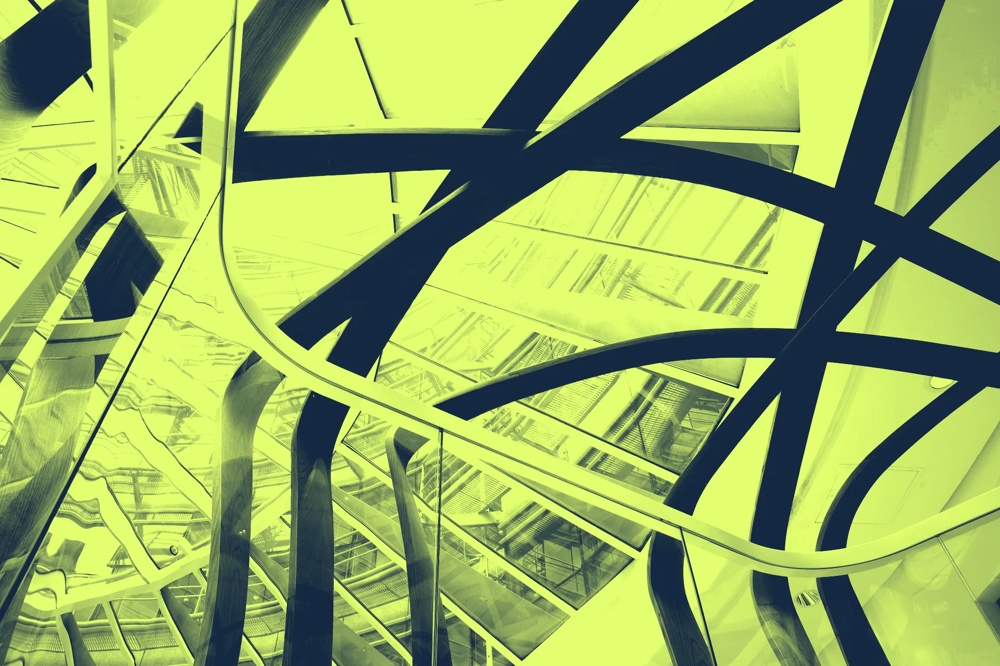 Abstraktes gelb-grünes Muster aus geschwungenen Linien und Glasflächen.