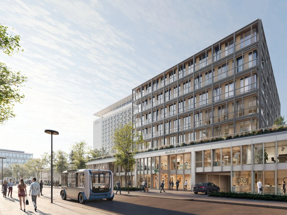 Street scene with modern building, autonomous bus and pedestrians under a blue sky.