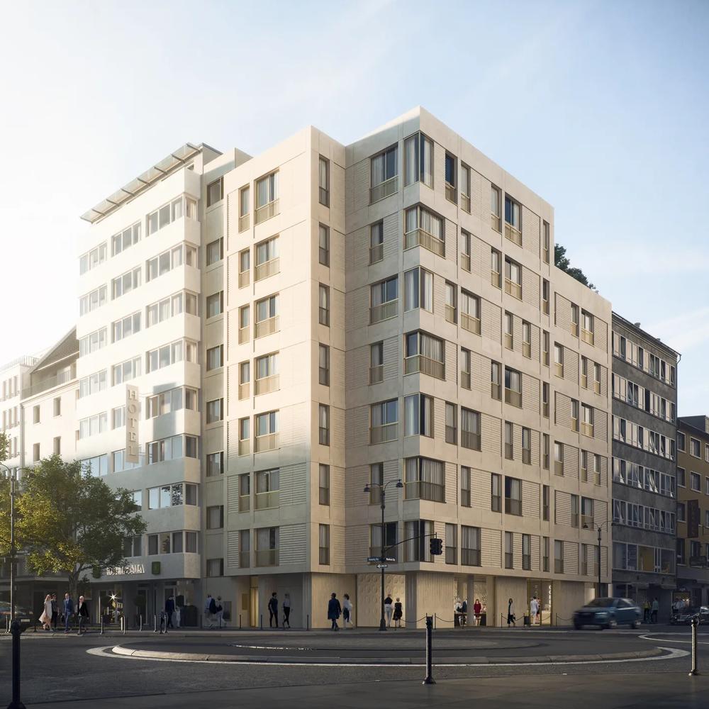 Ein modernes, mehrstöckiges Gebäude an einer Straßenecke mit Fußgängern und Autos im Vordergrund.