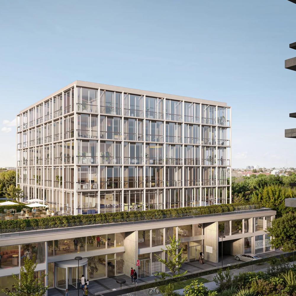 Modern glass building with a green roof garden and people on a terrace with a clear sky.